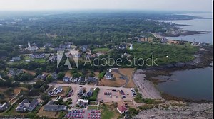 Cape Elizabeth Bluffs, coastal Maine. Two lighthouses and a lobster shack on the coast of southern Maine in the summer season. Dyer Cove with waves crashing on the coastline from a high altitude.