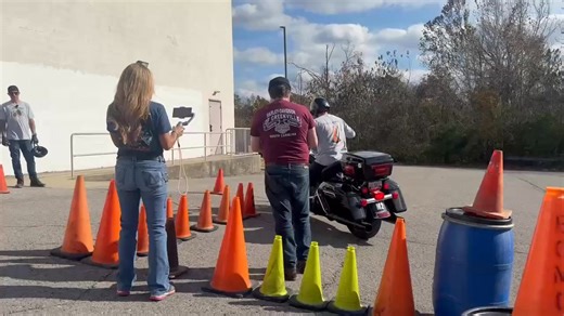 Instructor Ben Wolfe taking a run in the slow ride at the Lock & Lean 301 in Nashville. This slow ride started from a stop on a relatively steep uphill, a hard left over holes, cracks and uneven pavement and the made its way back downhill to the dead engine finish. Once riders get to the yellowish green cones, they have to cut their engine and slow ride the rest of the way without engine power. Quite the challenge. www.lockandlean.com | Lock and Lean Precision Motorcycle Riding LLC
