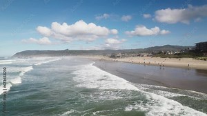 Cannon Beach at high tide as water meets the shore