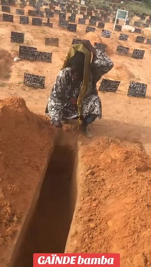 Woman Digging in Cemetery: A Symbolic Gesture