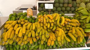 Close-up on a fruit stand. Fresh and tasty fruits. Useful and healthy food. Selection of fruits in the market