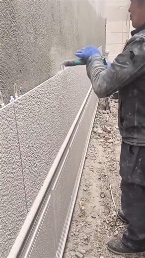 Using a drilling machine on the wall surface above the granite tile installation on the wall #shorts