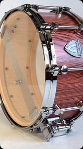If you’re a lover of exotic wood, this Snare Drum is made for you! Crafted from premium Maple wood with a stunning Rosewood outer ply, this drum is a true masterpiece. A jewel of an instrument, delivering both beauty and exceptional sound. We can custom-build it to your favorite size! ❤️ #customdrums #snaredrum | Varus Drums