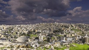 View of the modern houses Amman, Jordan, Middle East. Against the background of a beautiful sky with clouds. 4K, time lapse