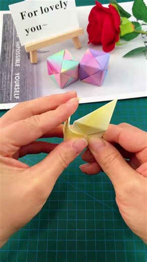 Fold a fun cube out of sticky notes.
