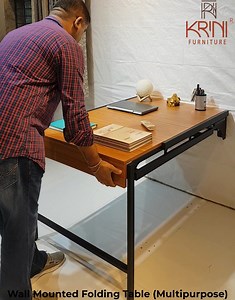 Multipurpose Wall Mounted Folding Table come Shelf The Wall-Mounted foldable table come Shelf is a functional piece of furniture that offers multiple functionalities with its innovative design. This wall mounted foldable table, can be used as computer desk ,writing table or coffee table, dining table as you like. 100% Made in India. Designed & sold exclusively by Krini Furniture Pvt Ltd. Buy this product here: https://www.pepperfry.com/sergio-wall-mounted-table-cum-book-shelf-in-nayana-teak-colo