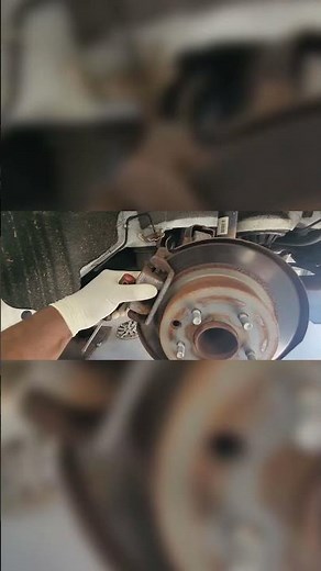 Compressing Caliper & Removing Bolt: Nissan Altima