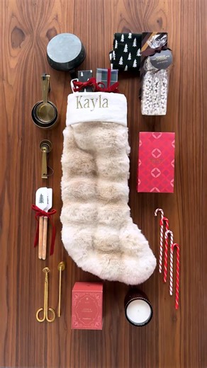Crate and Barrel on Instagram: "Surprise your bestie with a cute stocking filled with their faves! We love stocking stuffers that are chic and practical: gold measuring cups, mini spatulas and a scented candle. (And how cute are these candy cane drink stirrers? 😍) Check the link in our bio for our favorite stocking stuffers. #StockingStuffers #ChristmasGift #KitchenGift"