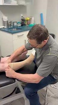 Donning Juzo Open-Toe Knee-High Compression Stockings