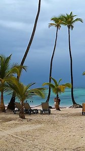 🌊The calm before the storm, but the beach never stops being dangerously welcoming and soothing. 💙 The crashing waves and the white sand, it's like nature's symphony playing in perfect harmony. 🎶 No matter what chaos may come, the beach remains a tranquil escape. 🏖 So let's soak up every moment and let the ocean wash away your worries. 🌊 Travel to nice places: Barcelo Bavaro Beach, Punta Cana, Dominican Republic 🇩🇴 🌞 #travel #beach #beaches #beachlife #trendingreels | World Around Travel