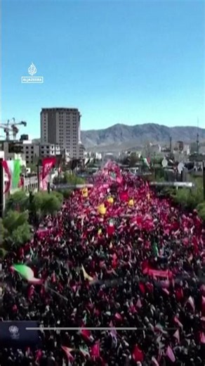 Crowds in Mashhad hold 'We will kill Trump' banner ahead of Khamenei burial
