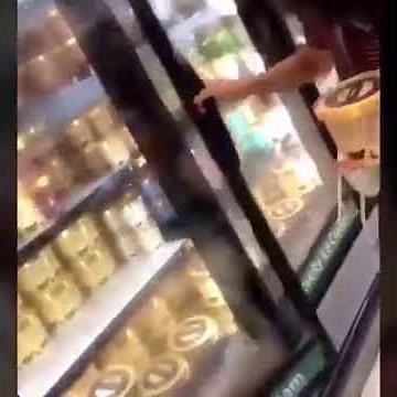 Girl licks Blue Bell ice cream and puts it back in freezer
