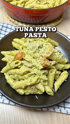 𝐓𝐮𝐧𝐚 𝐏𝐞𝐬𝐭𝐨 𝐏𝐚𝐬𝐭𝐚 200 grams penne or pasta of choice Salt and water for boiling 3 tbsp olive oil 4 cloves garlic, chopped 1 medium onion, chopped 180 grams canned tuna 1 cup heavy cream 1/3 cup pasta water 1/2 cup pesto 1 cup cherry tomatoes Salt and pepper to taste Grated parmesan cheese 1. Cook the pasta according to package instructions. Before draining, reserve about 1/3 cup of pasta water. 2. In a pan, add some olive oil. Saute the garlic and onion until soft and aromatic. 3. A