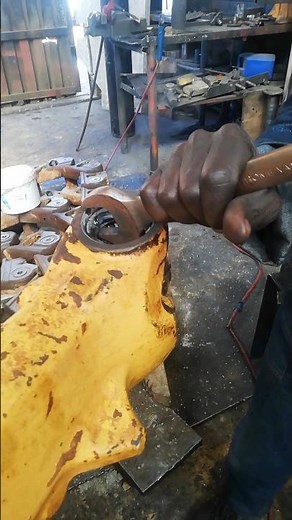 USING HANDY TOOLS: SPANNER AND NUT IN REMOVING STUCK WORN BUSH AFTER MIG WELDING IN REPAIRING AXLE