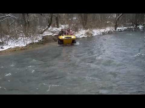 Attex and Max Amphibious 6x6 ATVs crossing a creek