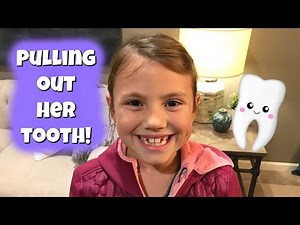 PULLING OUT HER TOOTH!