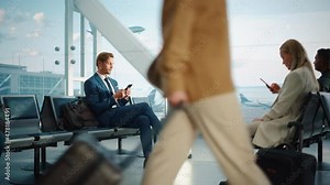 Airport Terminal: Businessman Uses Smartphone, Waiting for a Flight, Doing e-Business, Sending e-Commerce emails. Traveling Entrepreneur Remote Work Online Sitting in a Boarding Lounge of Airline Hub