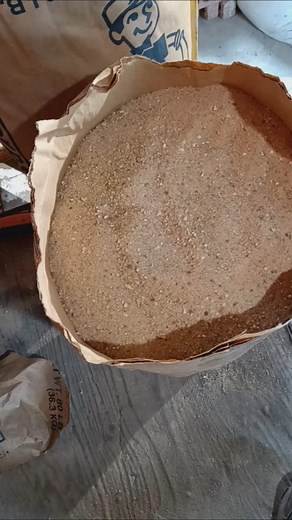 Kiln-dried sand we're putting this on the top of the oven. Because it was there before the fire and we're putting it back. | Al Santillo