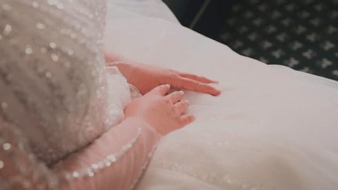 clip-3993501161-bride-gently-touches-her-hands