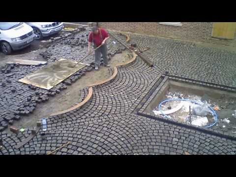 laying reclaimed granite setts for driveway and courtyard to French style