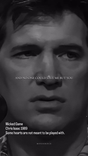 Kin on Instagram: "Some songs do not ask for your attention. They quietly take it. Chris Isaak singing Wicked Game live feels like standing too close to someone you should not want, but already do. Wicked Game was released in 1989 on Chris Isaak’s album Heart Shaped World, but it did not become a cultural obsession until it found its way into David Lynch’s film Wild at Heart. That placement changed everything. Suddenly, this slow, trembling ballad about desire and emotional surrender felt cinema