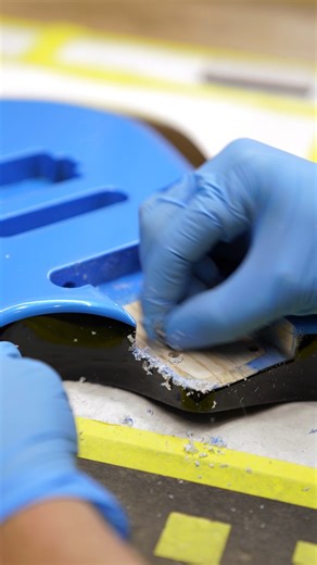 A Kiesel guitar tech snuggly fits a neck into a Zeus body | Kiesel Guitars