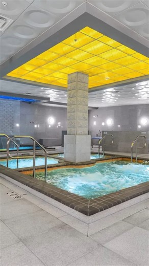 Let's visit King Spa in Chantilly Virginia. Entering, you are first separated by gender, into specific locker rooms. The first set of lockers are small lockers for your shoes. Then, the larger lockers for your clothes. You are given an electronic wristband to use to unlock and lock the lockers. You just tap them on the knob to toggle the lock. The lockers are half-height, with hangers, and are a decent size to fit all of your clothes and a small bag. Inside the locker room, you find the bath hou