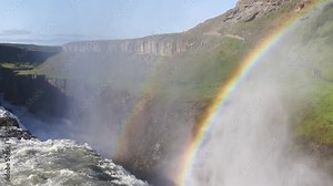 Close up of the magnificent Gullfoss Waterfall, Iceland. The Hvita river cascading into the canyon wit spray forming a rainbow