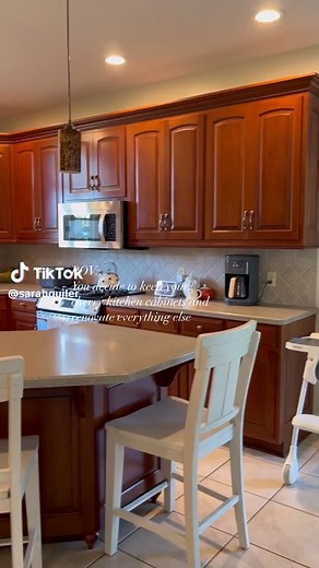 Unpopular opinion: keep your cherry kitchen cabinets, update everything else 💡✨ New year, new kitchen! Here’s a first look at our kitchen remodel. We changed everything in the kitchen BUT our cabinets. What do you think? Are all white kitchens out? I always say do what makes you happy when it comes to home design. The latest trends will fade and you’re the one that is living in your home and gets to enjoy it each day! Follow my shop @sarahguiler on the @shop.LTK app to shop this post and get my