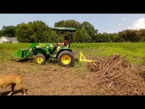 Landscape rake attachment on john deere tractor