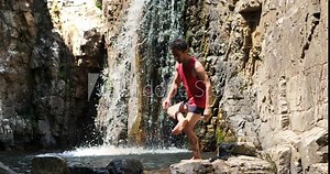 In the heart of the forest, a skilled yogi, mastered in the tranquility of flowing water, finds inner peace and serenity through yoga practice