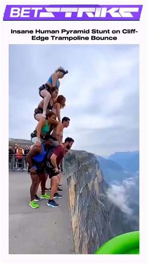 Trandhub.in on Instagram: "Epic Cliff-Edge Human Pyramid Trampoline Launch! 😱 Imagine this: a fearless crew of thrill-seekers stacks themselves into a towering human pyramid—six bodies high—and sprints full speed toward a massive green trampoline perched right on the razor-thin edge of a misty cliff, with nothing but clouds and a heart-dropping void below. “3… 2… 1…” They hit the trampoline together in perfect sync, and BOOM—the entire pyramid explodes upward in a jaw-dropping launch! Bodies se