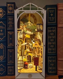 44K views · 11 reactions | “I've just got this Sunshine Town Book Nook from Anavrin, and I'm so in love with it! Look how beautiful it sits in between my books! It's super fun and extremely easy — I had a great time building it! - Danielle W. Craft yours today → https://byanavrin.com/products/sunshine-town-miniature-book-nook-shelf-insert-anavrin | Anavrin | Facebook