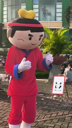 Slanted-eye clown in a red shirt