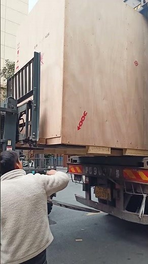 Yaskawa Robot PL190 Loaded into Container with Coordinated Forklifts