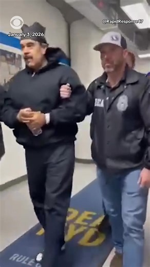 The White House Rapid Response account shared a video on X that appeared to show Maduro. It included the caption: "Perp walked." He appears to be walking down a hallway on a carpet that states, "DEA NYD," and is escorted by three men in Drug Enforcement Administration jackets. At the end of the video, Maduro can be heard saying, "Good night. Happy New Year." | CBS News