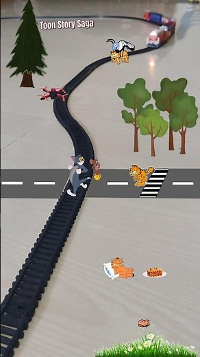 Garfield running behind Tom and Jerry near the track and train is approaching fast| USA