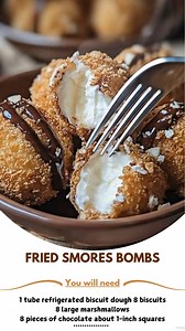 Fried ⭐ Smores Bombs Ingredients: - 1 tube refrigerated biscuit dough 8 biscuits - 8 large marshmallows - 8 pieces of chocolate about 1-inch squares, or equivalent chocolate chips - 1/2 cup crushed graham crackers - 1/4 cup granulated sugar - 1 teaspoon ground cinnamon - Vegetable oil, for frying - Chocolate sauce, for drizzling Directions: ..... Full Recipe in Coʍmеոτ 💬 🐫 | Grandma's Recipes