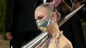 Amidst All The AOC Dress Talk, Let's Not Forget Grimes Showed Up To The Met Gala With A Sword