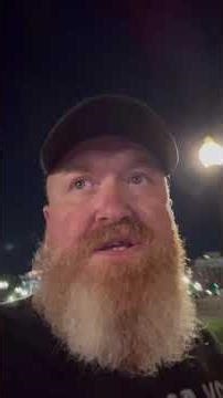 MAGA agitator pepper sprays a black woman while she is laying on the ground.