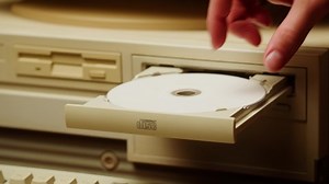 clip-1095040151-using-cd-circle-disk-old-computer-dvd