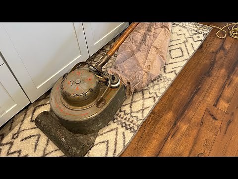 In operation: 1908 Hoover Model O Vacuum Cleaner; first portable household electric sweeping device