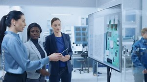 Concept Developer, Computer Engineer and Project Manager Use Digital Interactive Whiteboard That Shows 3D Printed Circuit Board Concept. Developers Find Problem Solution. Modern Factory Meeting Room