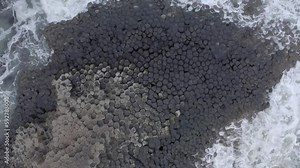 Ocean Waves Crashing Against Hexagonal Basalt Rock Formation at Giant's Causeway