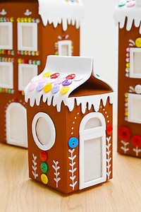 This milk carton gingerbread house is such an ADORABLE Christmas craft, and it’s so much fun to make! It’s the perfect way to get the whole family involved in a sweet holiday tradition, minus the worry of little hands sneaking bites when you turn your back! https://onelittleproject.com/milk-carton-gingerbread-house/ | One Little Project