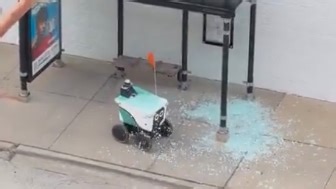 Delivery robot drove through the glass of a bus shelter