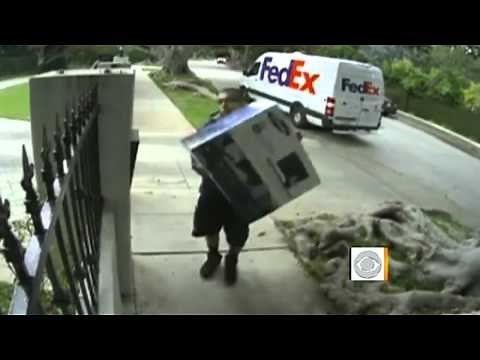 On tape: Apparent FedEx worker throws box over fence