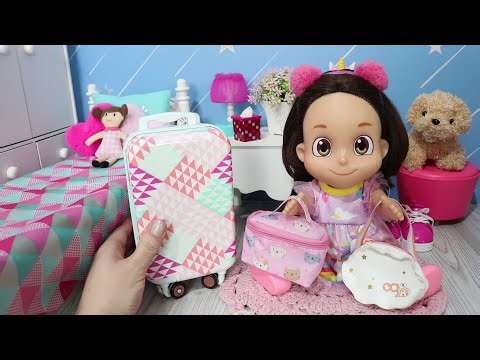 Maria Clara packing her little bag for the weekend.