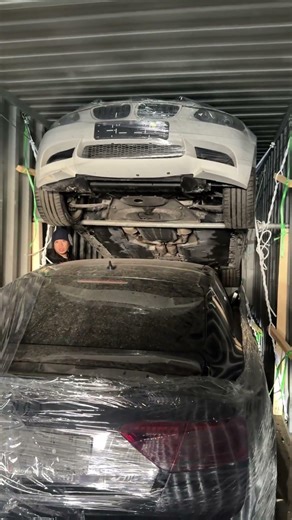 Mercedes AUDI BMW loading into a container