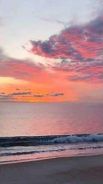 Gloriously Pink Clouds at Sunrise with Soothing Crashing Waves